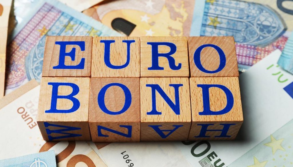 Wooden cubes with word Eurobond on euro banknotes