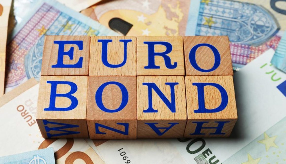 Wooden cubes with word Eurobond on euro banknotes