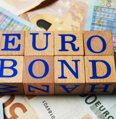 Wooden cubes with word Eurobond on euro banknotes